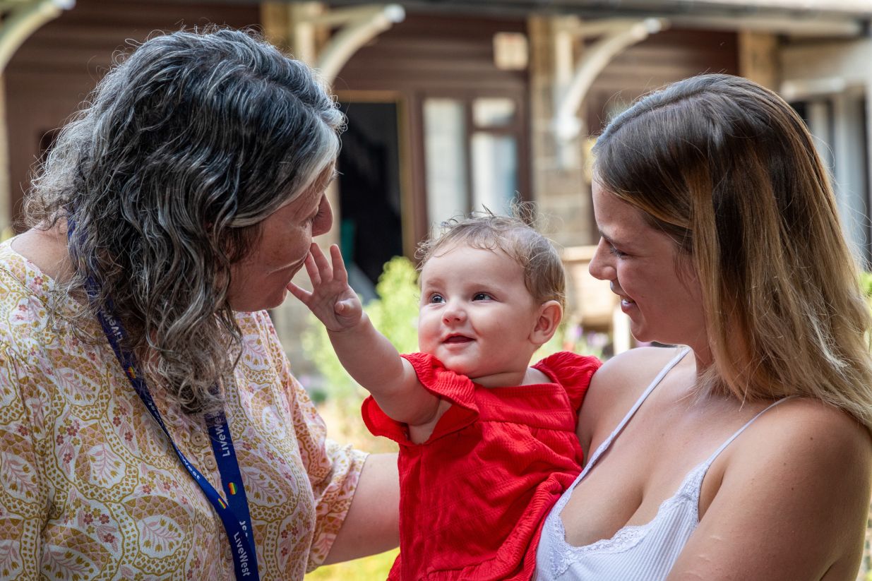 Samara and Rozie-Mae smiling with a LiveWest colleague.