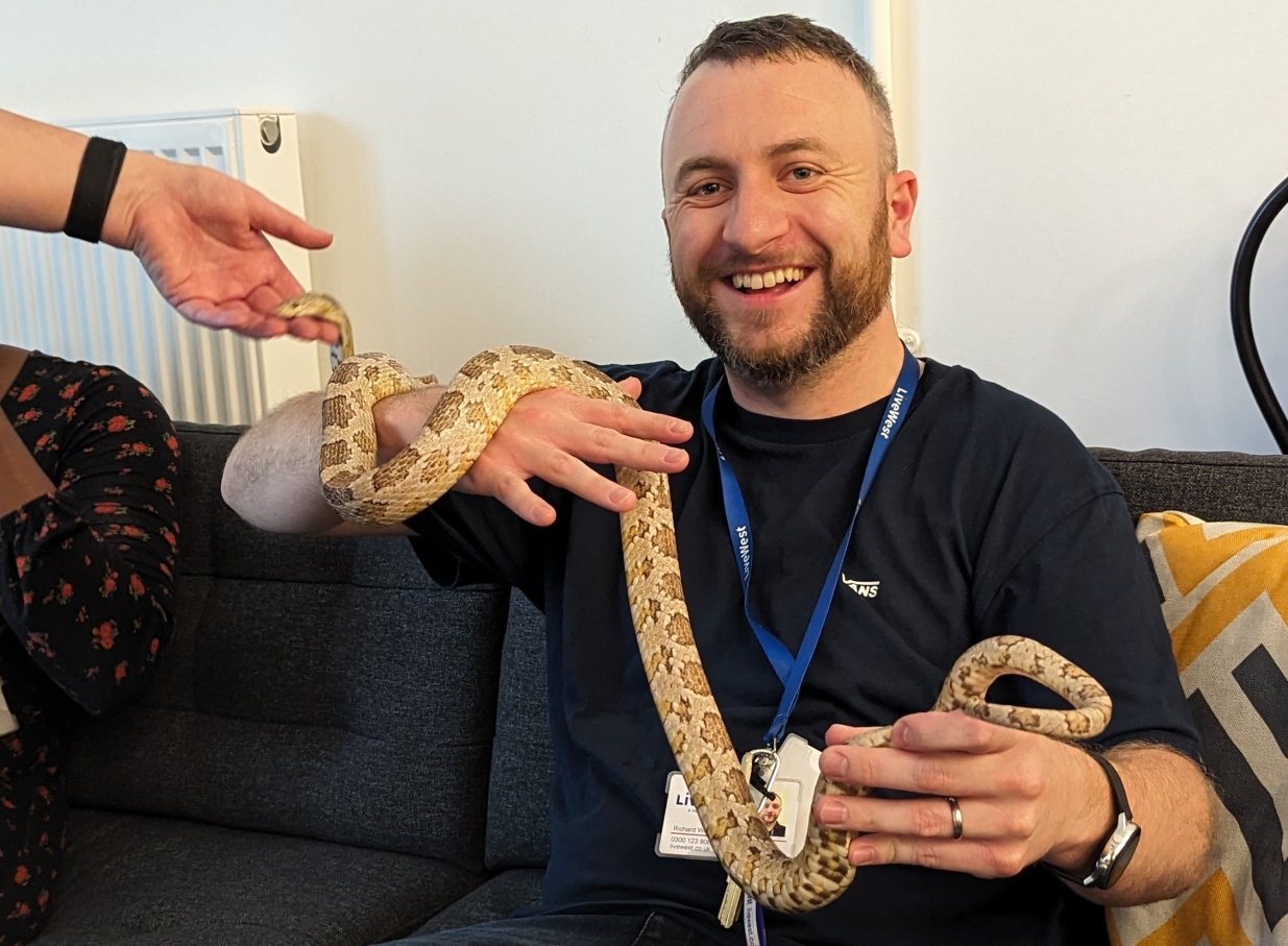 One of our LiveWest colleagues with a snake.