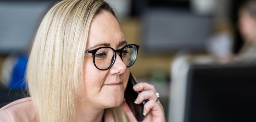 LiveWest colleague speaking on a mobile phone. 