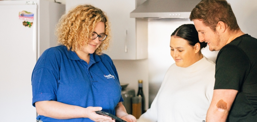 LiveWest colleague talking to two customers in a kitchen