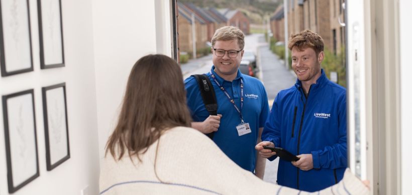 George and Craig chatting to a resident at her front door.