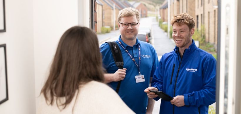 Trades colleagues at a customer's door