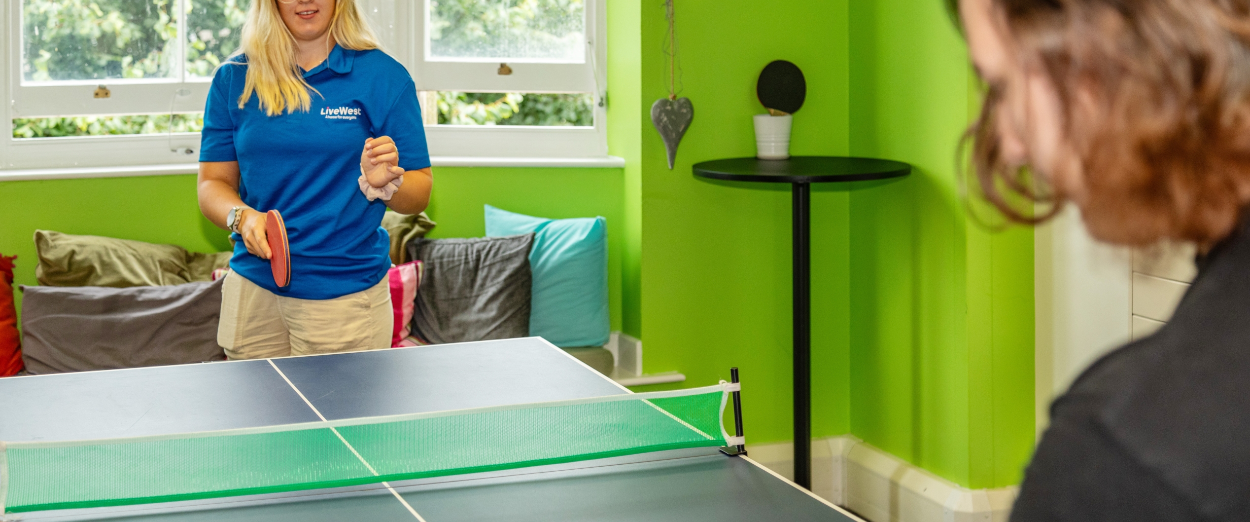 People playing table tennis in Redruth Foyer