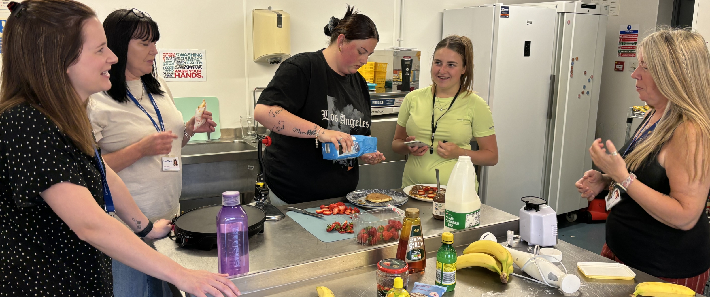 Plymouth Foyer kitchen with people in