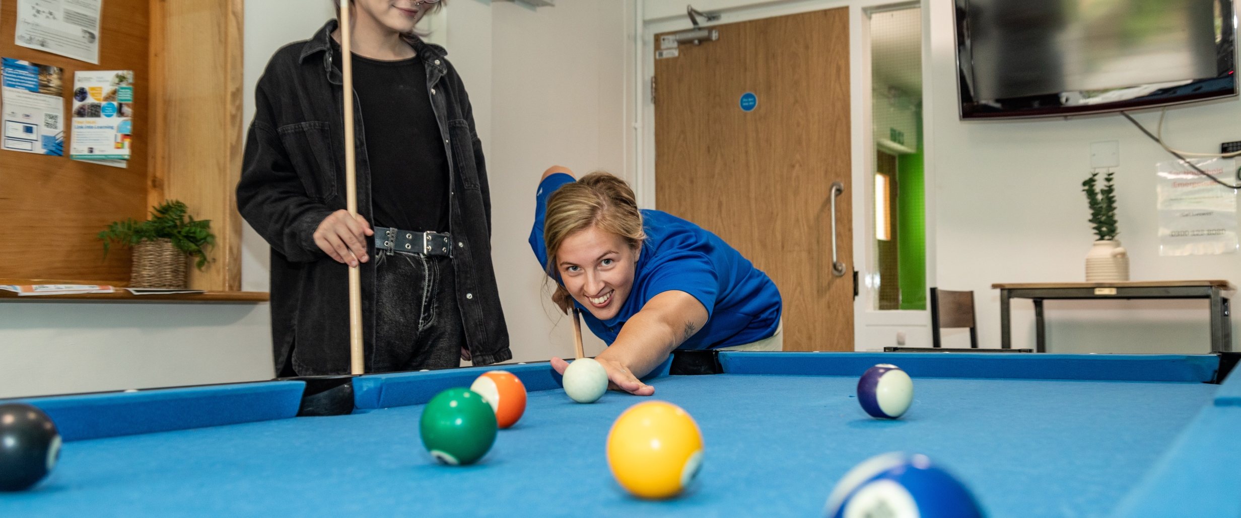 Playing pool in Truro Foyer