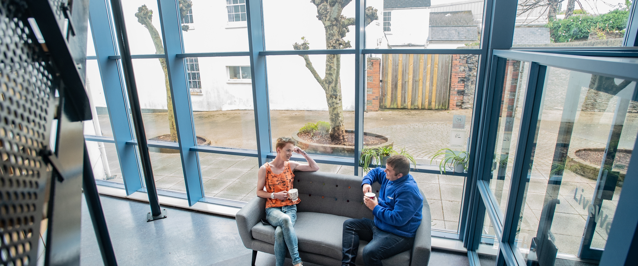 People chatting in Torbay Foyer