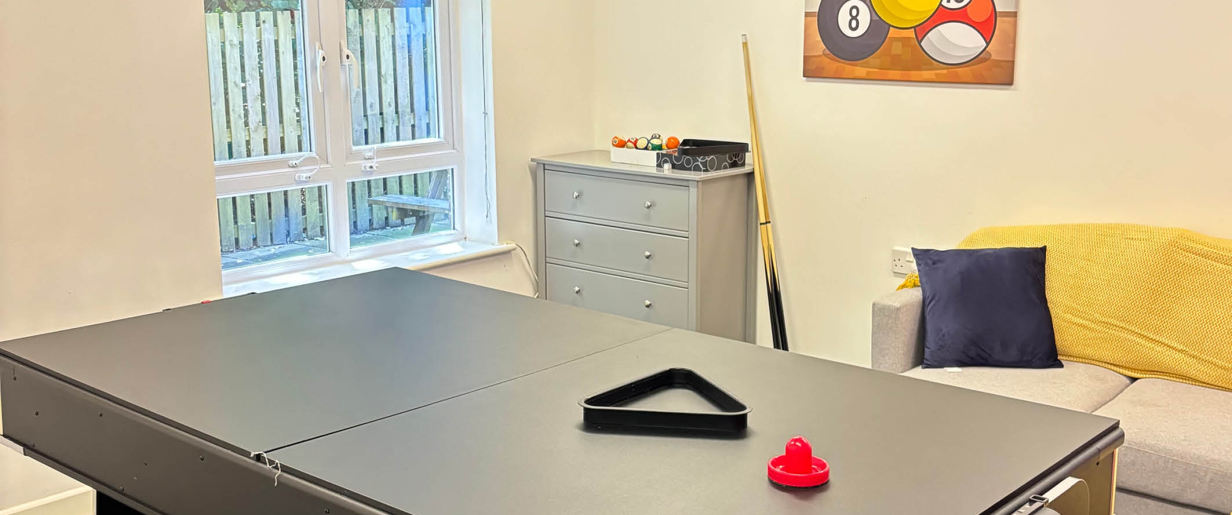 Games room with pool table. 