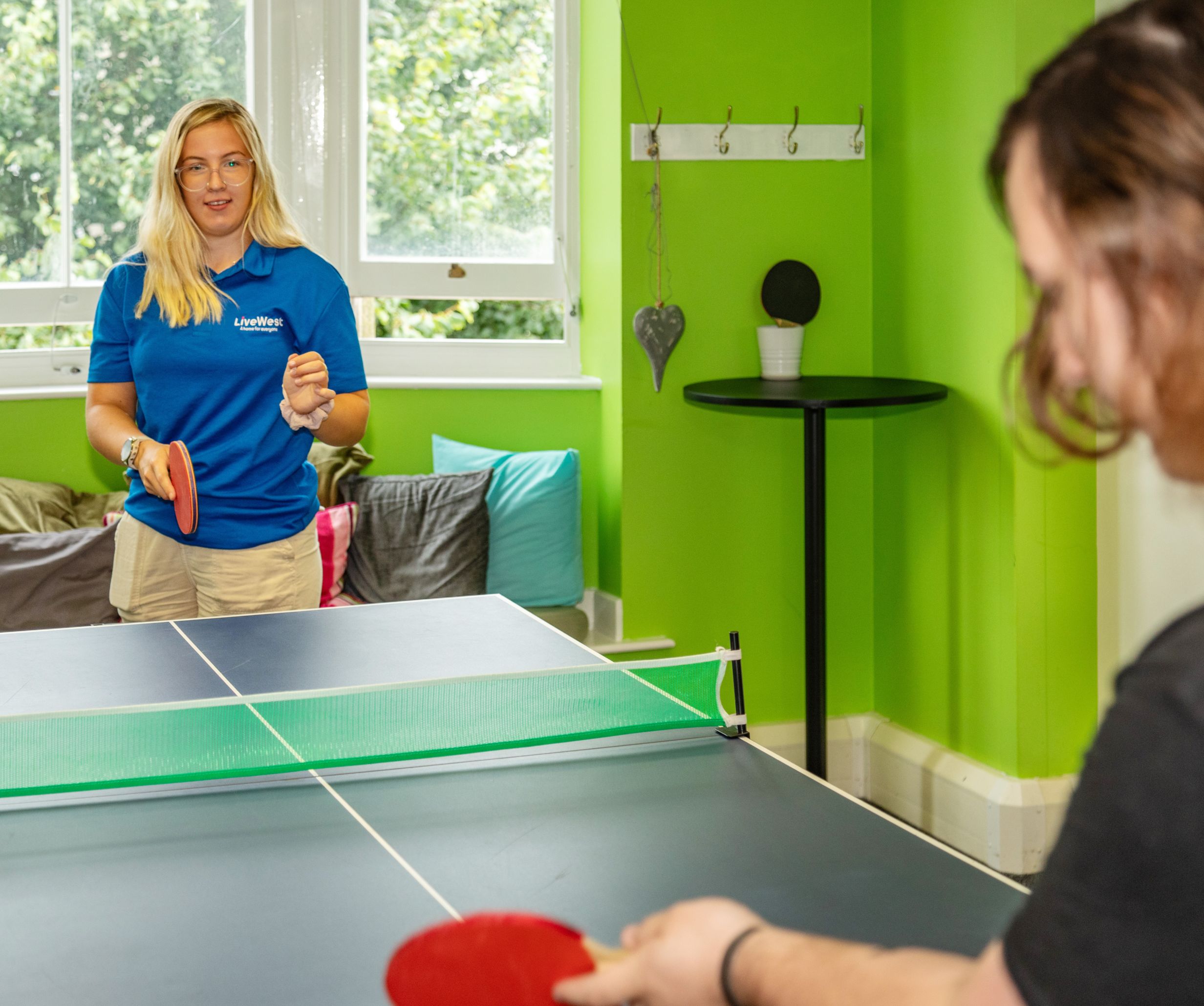 People playing table tennis in Redruth Foyer