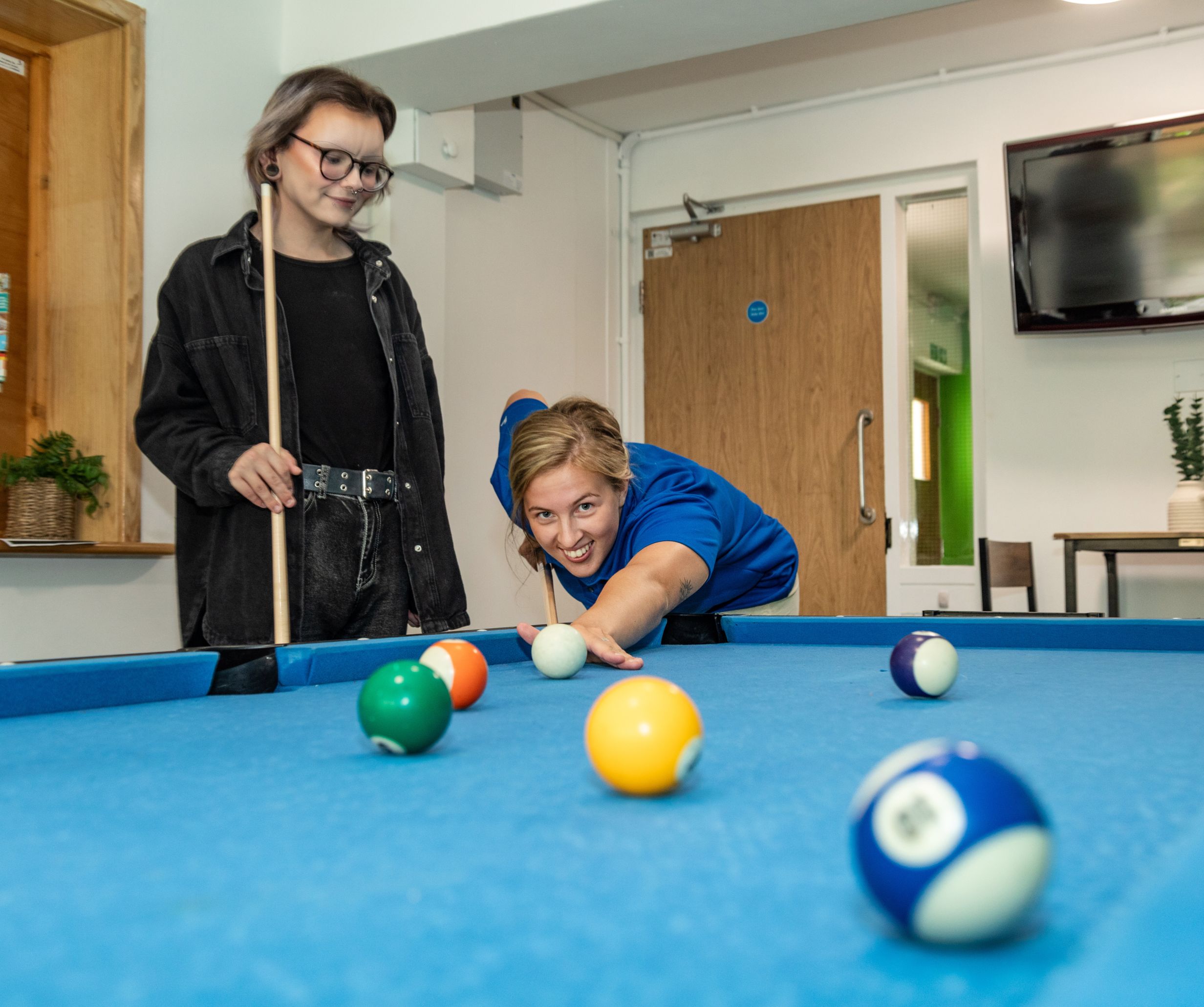 Playing pool in Truro Foyer