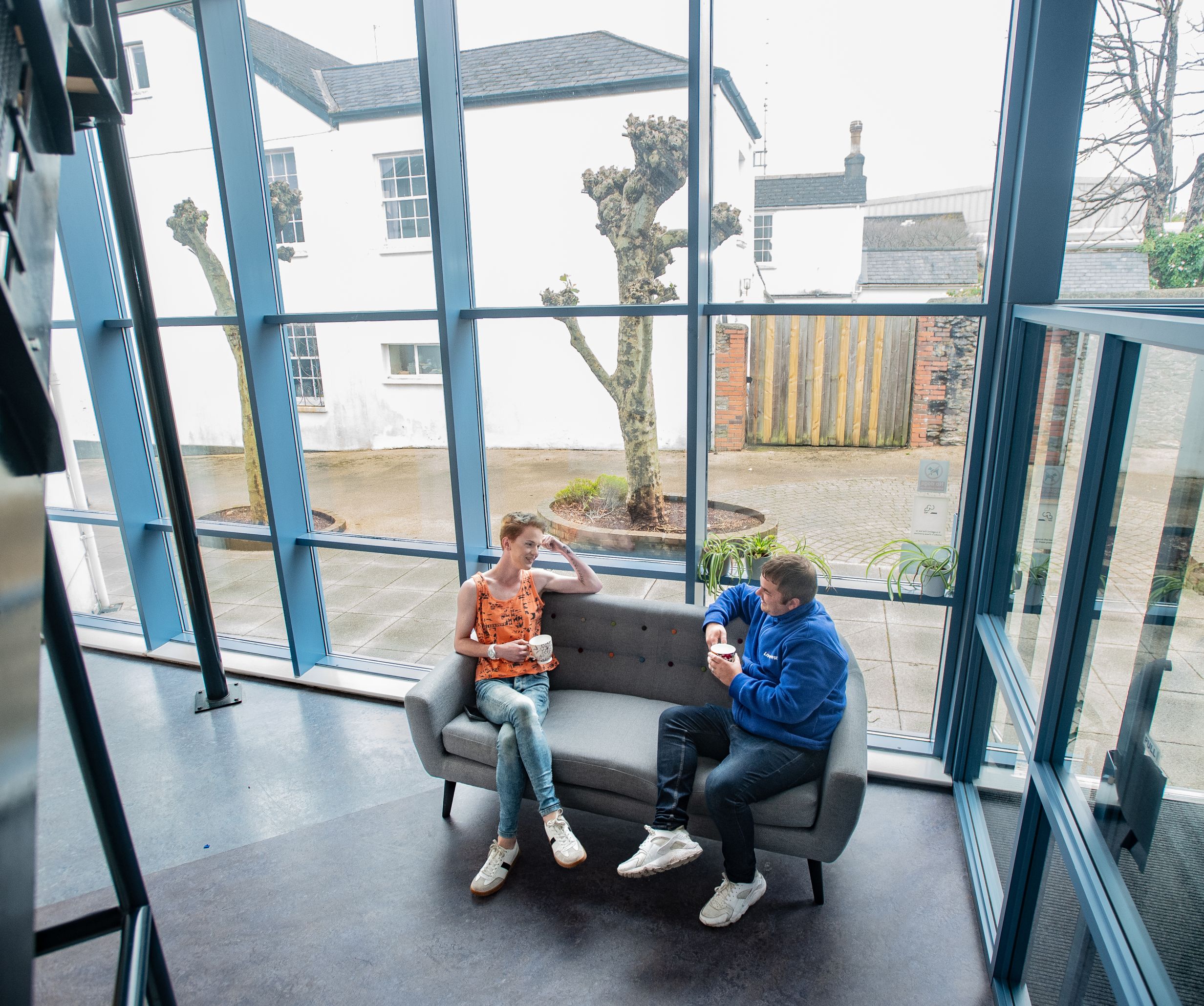 People chatting in Torbay Foyer