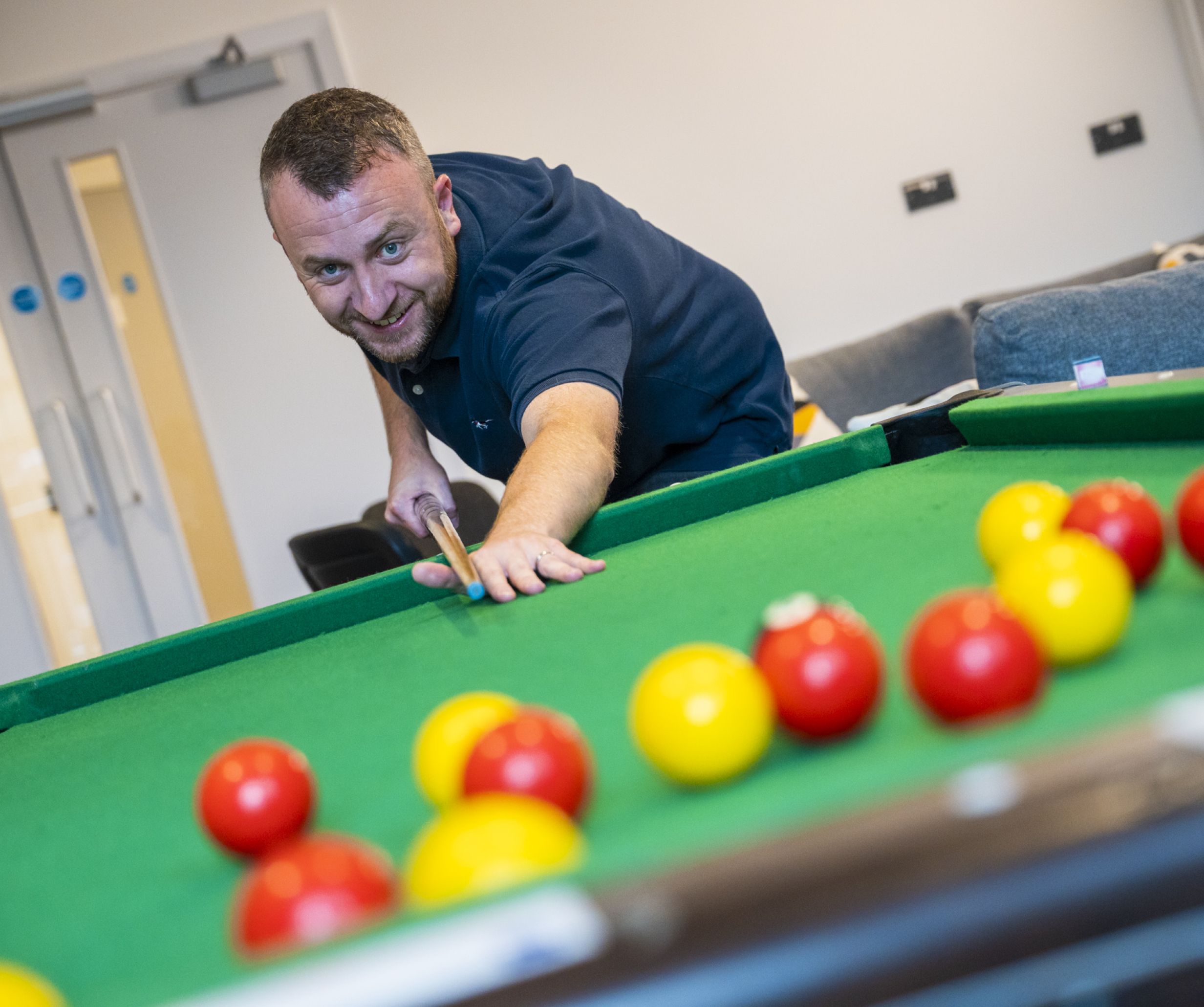 Playing pool at Bristol Foyer