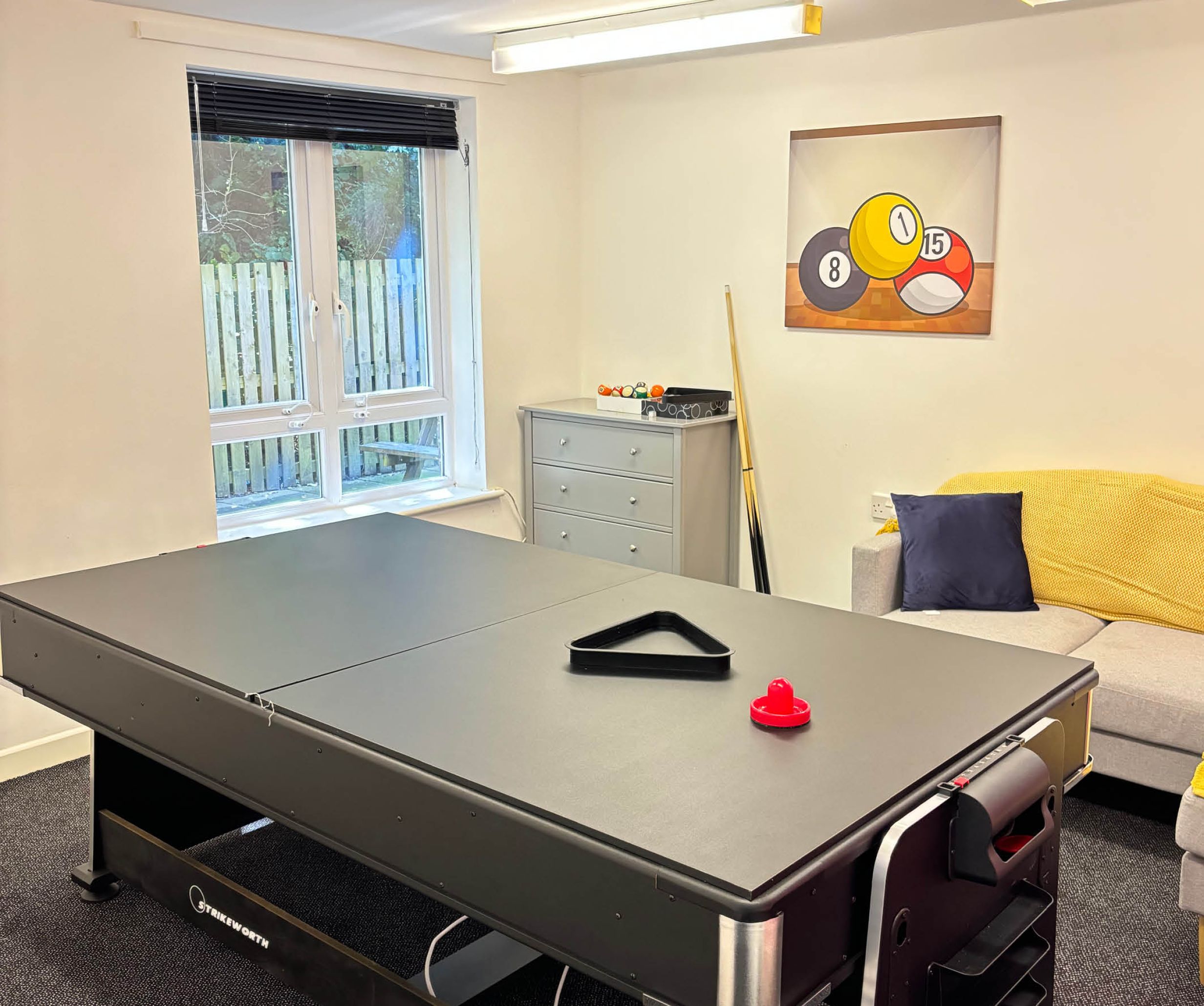 Games room with pool table. 