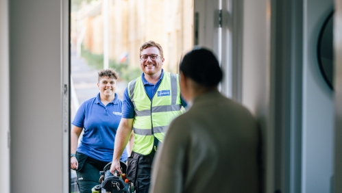 LiveWest colleagues at the door of a customers' home. 