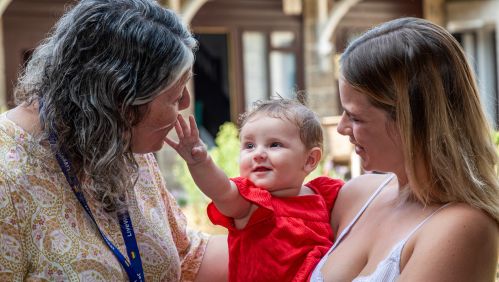 Image of Samara with her child and a LiveWest colleague. 