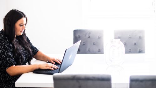 Image of a woman using a laptop. 